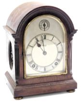 An early 20thC mahogany cased mantel clock, for Geo. Tarratt Leicester, arched silver dial with chap