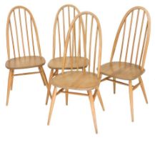 Four Ercol Quaker light elm dining chairs.