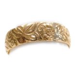 An 18ct gold wedding band, floral and foliate engraved, size P½, 4.7g.