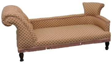 A late Victorian chaise lounge, upholstered in pink and red draylon, raised on oak feet, 166cm wide.