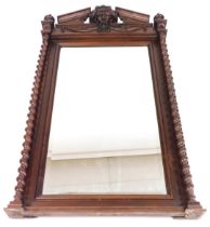 A late 19thC French cherry wood pier glass, with a rectangular bevelled glass plate, the break arch