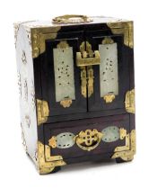 A Japanese hardwood cabinet, brass bound, with carved jadeite panels, 24cm x 17cm x 13.5cm.