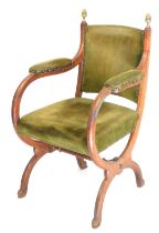 A Victorian oak armchair, upholstered in green dralon.