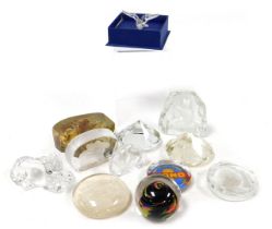 A group of paperweights and sculptures, including advertising weights for Griffiths Bros and Company