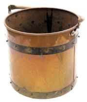 An early 20thC copper and brass cylindrical coal or log bucket, 29cm high.