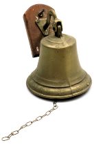 A brass wall mounting bell, 22cm high.