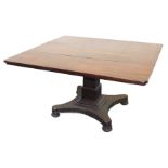 An early Victorian mahogany tilt top breakfast table, the rectangular top raised on a square stepped