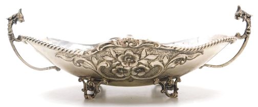 A Greek silver twin handled dish, of oval footed form, embossed with flowers, stamped 925, EPT.XEIPO