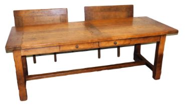 An oak refectory dining table, with two side leaves and two frieze drawers, raised on square legs un