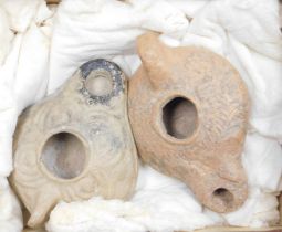 Two Roman terracotta oil lamps, reportedly 4 century AD from Syria.