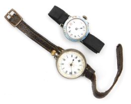 An early 20thC silver cased wristwatch, with a pocket watch winder, circular enamel dial bearing Rom