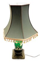 An early 20thC Continental green glass table lamp, gilt decorated with flying geese over bullrushes,