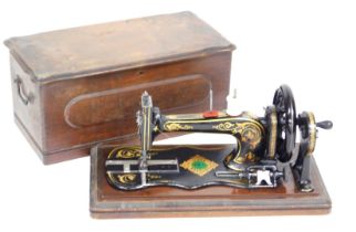 A Victorian Jones Family sewing machine, transverse shuttle, serial number 17371, boxed.