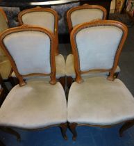 Four French style dining chairs.