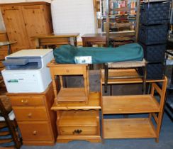 A suite of pine furniture, including a three drawer chest, a small two tier occasional table with si