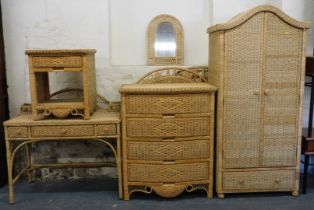 A rattan or cane style bedroom suite, comprising two door wardrobe, four drawer chest, dressing tabl