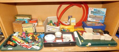 A Matchbox carry case, various toy cars, games including dominoes and chess, and trading cards. (1