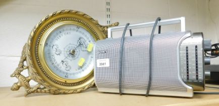 A neo-classical brass framed wheel barometer and a Sony portable radio.