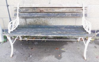 A metal and wooden two seater garden bench.