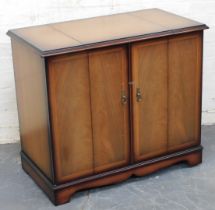 A mahogany veneered music cabinet, with two folding doors to front, lift top exposing a Technics tur
