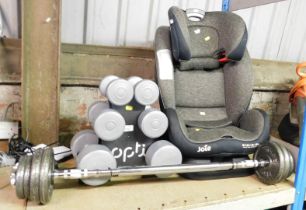 Weight lifting equipment, including dumbbells, bar bell, and a child's seat.