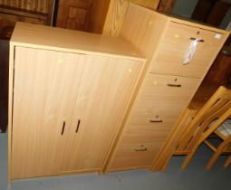 A four drawer filing chest and an office cupboard, of two doors. (2) This lot is to view and collec