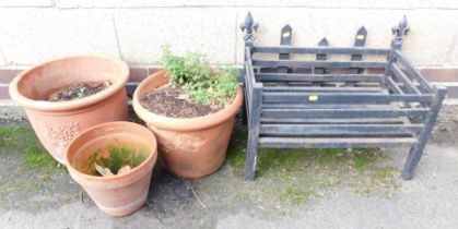 Three terracotta planters and a metal fire basket.
