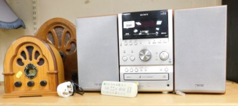 A Sony three disc changer S Master digital amplifier system and two table top radios.