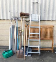 A set of aluminium step ladders, various garden tools to include hoes, rakes, brushes, etc.