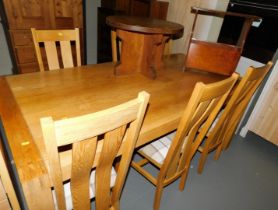 A modern oak dining table and six chairs, two occasional tables, one with magazine rack below. (10)