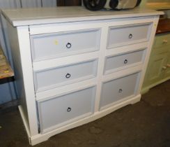 A white and grey painted pine chest of two short over two short above two deeper short drawers, rais