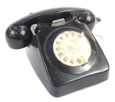 A black dial telephone, 910.
