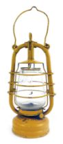 A Feuerhand yellow painted paraffin lamp, number 201, 40cm high.