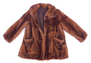 A mink coat, underarm measurement approx 53cm.
