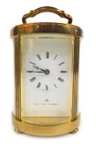 A 20thC brass cased carriage clock, the rectangular white enamel dial bearing Roman numerals for Mat
