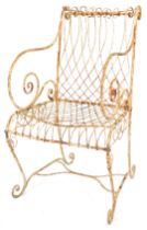 A Victorian wrought iron garden chair, with scroll framing.