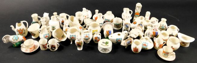 A collection of various crested china ornaments, to include Pearl Arms China, Carlton, W H Goss, and