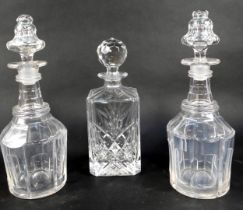 Three cut glass decanters, comprising decanter of square form, with stopper, 26cm high, and two simi