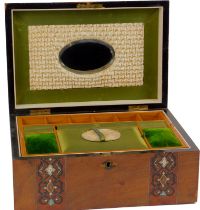 A 19thC walnut and marquetry inlaid jewellery box, the hinged lid enclosing an oval mirror inset top