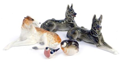 A group of Russian porcelain dog figures, to include Borzoi, German Shepherds, etc., each with print