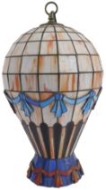 A Tiffany style pendant light shade, modelled as a hot air balloon, in pale pink with banded blue an