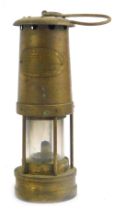 An E Thomas and William Ltd brass miner's lamp, 24cm high.