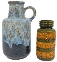 A West German pottery flagon, of cylindrical shouldered form, with ring handle, in mottled blue glaz