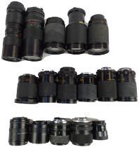 An assortment of camera lenses, including three Vivitar telephoto lenses, macro focusing zoom, etc.