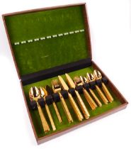 A Stanley Roberts stainless steel gilt plated canteen of cutlery, for eight place settings, each han