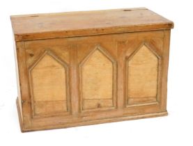 A 19thC pine coffer, of rectangular form, the front decorated with three arched sections, the hinged
