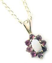 A 9ct gold pendant and chain, the floral cluster pendant set with opal and garnet, on a fine link ne