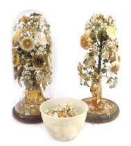 Two Victorian shell encrusted displays, modelled as floral bouquets, one contained in a glass dome,