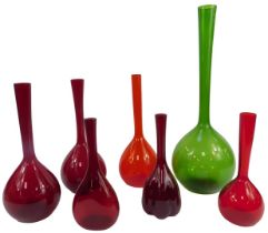 A group of glass vases, each of bottle form with elongated glass neck, in green, 50cm high, and six
