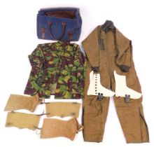 A canvas air crew bag, containing quilted green GE Tekskon GNBH overalls, camouflage ware, etc.